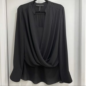 BCBG MaxAzria black long sleeve blouse. Roll up sleeve longer back
